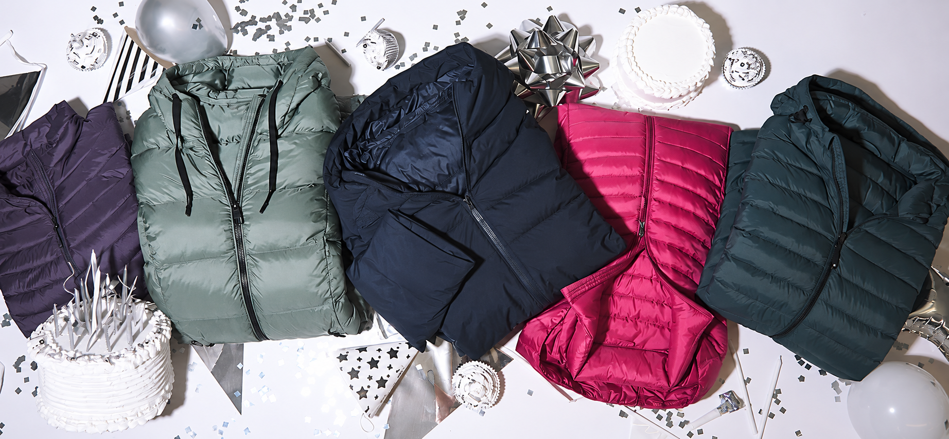 Colorful outerwear arranged on a light background